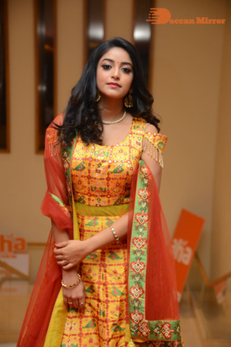 Telugu Actress Nakshatra photoshoot in a yellow Lehenga Choli dress