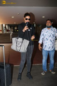 bollywood actress Nargis Fakhri glamorous looks in white hoodie and sunglasses