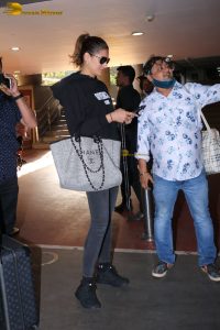 bollywood actress Nargis Fakhri glamorous looks in white hoodie and sunglasses