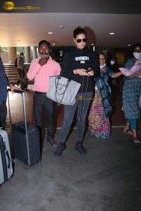 bollywood actress Nargis Fakhri glamorous looks in white hoodie and sunglasses