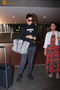 bollywood actress Nargis Fakhri glamorous looks in white hoodie and sunglasses