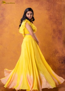 actress Naveena Reddy sweet looks in a yellow dress