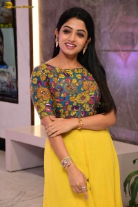 telugu actress navya swamy in a yellow dress posing for photoshoot