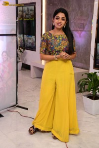 telugu actress navya swamy in a yellow dress posing for photoshoot