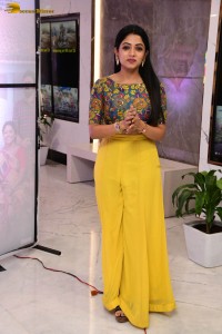 telugu actress navya swamy in a yellow dress posing for photoshoot