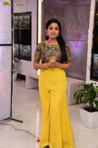 telugu actress navya swamy in a yellow dress posing for photoshoot