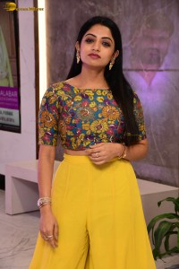 telugu actress navya swamy in a yellow dress posing for photoshoot