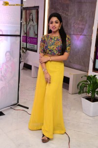 telugu actress navya swamy in a yellow dress posing for photoshoot