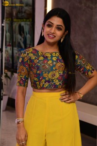 telugu actress navya swamy in a yellow dress posing for photoshoot