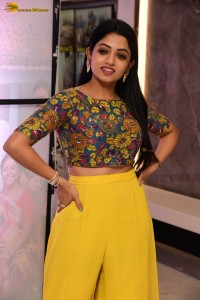 telugu actress navya swamy in a yellow dress posing for photoshoot