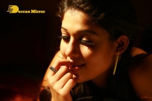 Nayanthara in a jeans mini-skirt sporting big plastic ear rings
