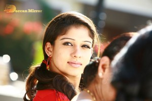 Nayanthara in a jeans mini-skirt sporting big plastic ear rings