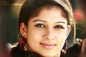 Nayanthara in a jeans mini-skirt sporting big plastic ear rings