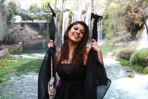 Nayanthara in a black shoulder less dress with loose hair