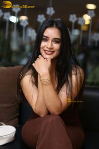 actress neha krishna gorgeous in a brown dress