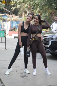 Actress sisters Neha Sharma and Aisha Sharma pose for pictures after a gym workout