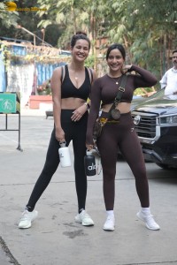 Actress sisters Neha Sharma and Aisha Sharma pose for pictures after a gym workout