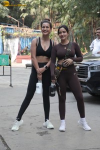 Actress sisters Neha Sharma and Aisha Sharma pose for pictures after a gym workout