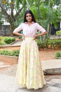actress Neha Solanki gorgeous in a pink shirt and yellow skirt