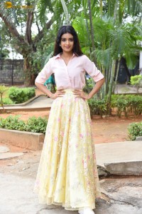 actress Neha Solanki gorgeous in a pink shirt and yellow skirt