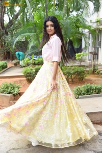 actress Neha Solanki gorgeous in a pink shirt and yellow skirt