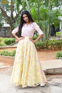 actress Neha Solanki gorgeous in a pink shirt and yellow skirt