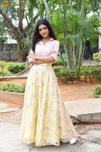 actress Neha Solanki gorgeous in a pink shirt and yellow skirt