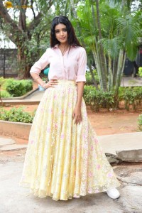 actress Neha Solanki gorgeous in a pink shirt and yellow skirt