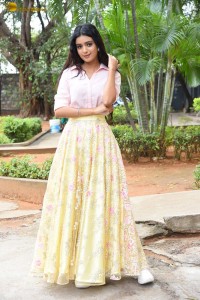 actress Neha Solanki gorgeous in a pink shirt and yellow skirt