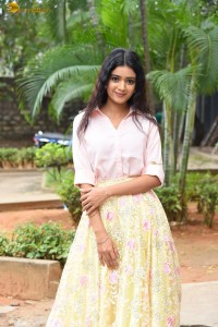 actress Neha Solanki gorgeous in a pink shirt and yellow skirt