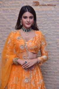 Actress Nidhhi Agerwal in a orange Lehenga Choli Dress