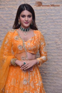 Actress Nidhhi Agerwal in a orange Lehenga Choli Dress