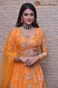 Actress Nidhhi Agerwal in a orange Lehenga Choli Dress