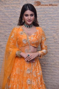 Actress Nidhhi Agerwal in a orange Lehenga Choli Dress