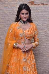 Actress Nidhhi Agerwal in a orange Lehenga Choli Dress