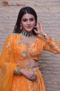 Actress Nidhhi Agerwal in a orange Lehenga Choli Dress