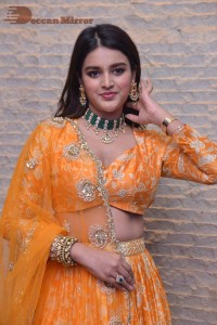 Actress Nidhhi Agerwal in a orange Lehenga Choli Dress