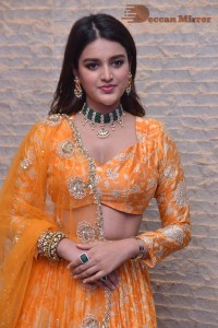 Actress Nidhhi Agerwal in a orange Lehenga Choli Dress