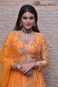 Actress Nidhhi Agerwal in a orange Lehenga Choli Dress