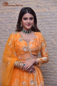 Actress Nidhhi Agerwal in a orange Lehenga Choli Dress