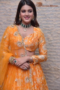 Actress Nidhhi Agerwal in a orange Lehenga Choli Dress