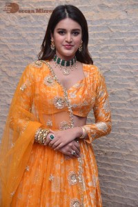 Actress Nidhhi Agerwal in a orange Lehenga Choli Dress