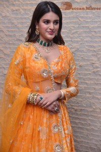 Actress Nidhhi Agerwal in a orange Lehenga Choli Dress