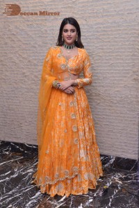 Actress Nidhhi Agerwal in a orange Lehenga Choli Dress