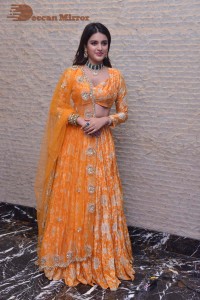 Actress Nidhhi Agerwal in a orange Lehenga Choli Dress