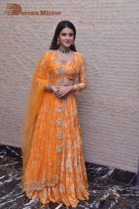 Actress Nidhhi Agerwal in a orange Lehenga Choli Dress