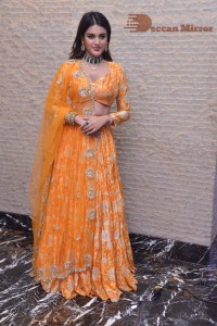 Actress Nidhhi Agerwal in a orange Lehenga Choli Dress