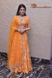 Actress Nidhhi Agerwal in a orange Lehenga Choli Dress