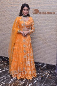 Actress Nidhhi Agerwal in a orange Lehenga Choli Dress