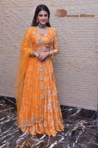 Actress Nidhhi Agerwal in a orange Lehenga Choli Dress